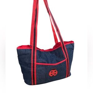 Handmade denim tote bag with red trim and a ladybug appliqué. 16”x 10”x 5” New